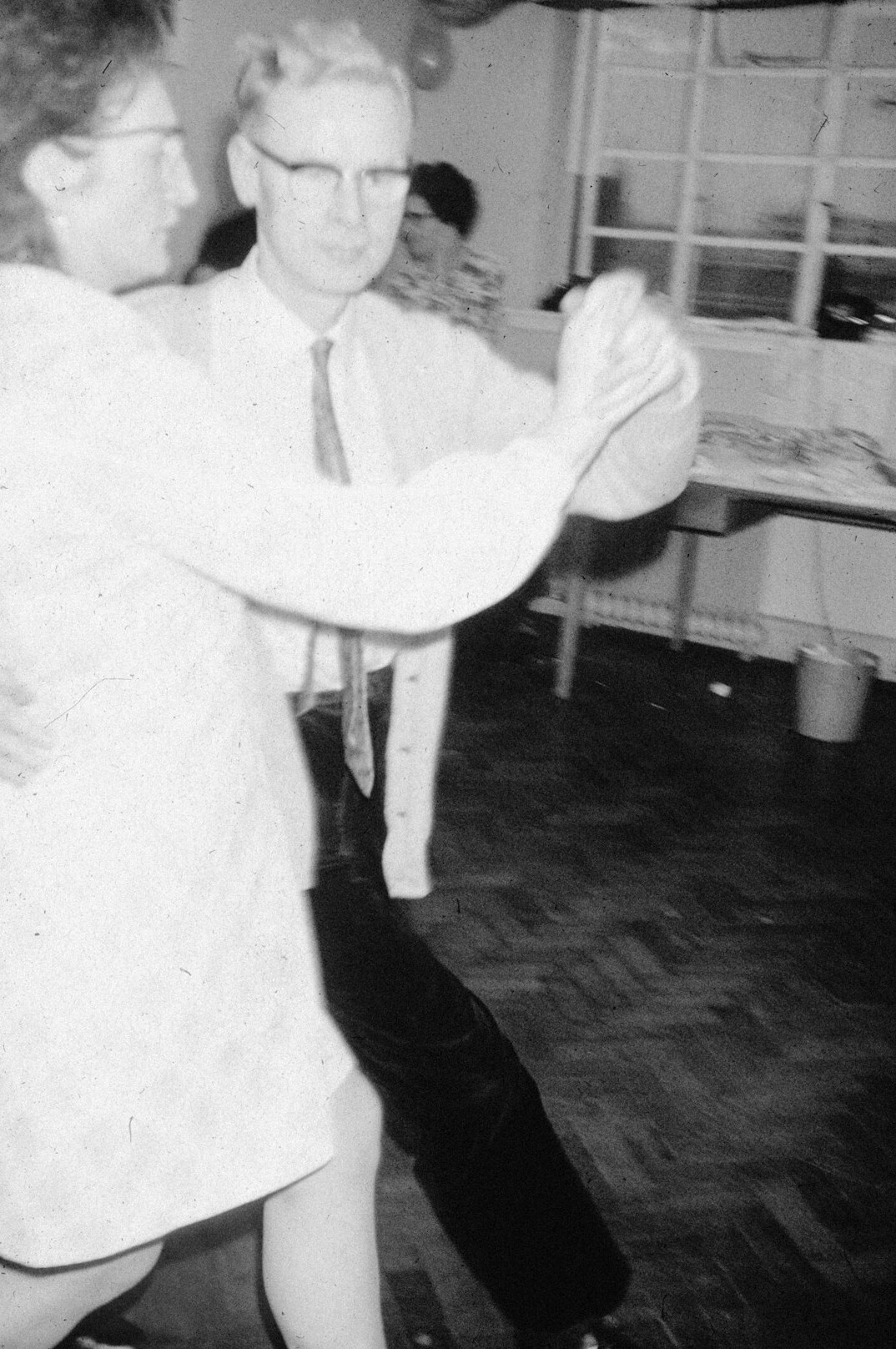 Senior couples dancing together in a hall