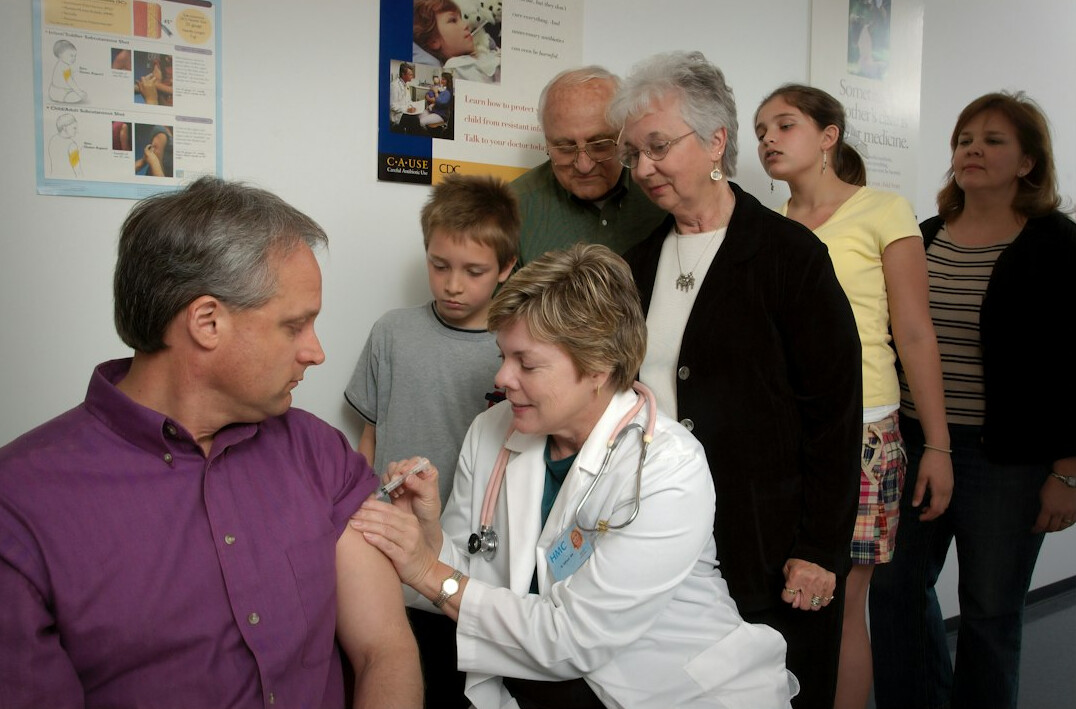 Seniors attending a health talk listening to a doctor