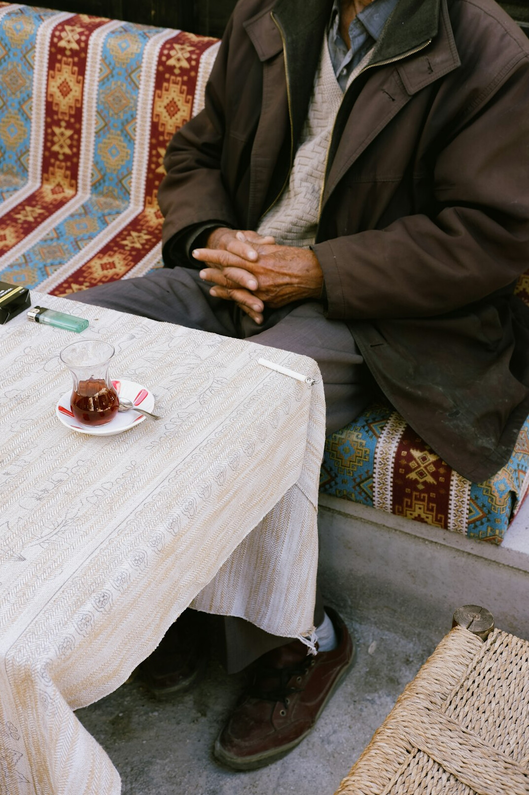 Seniors chatting over tea and cake at a table