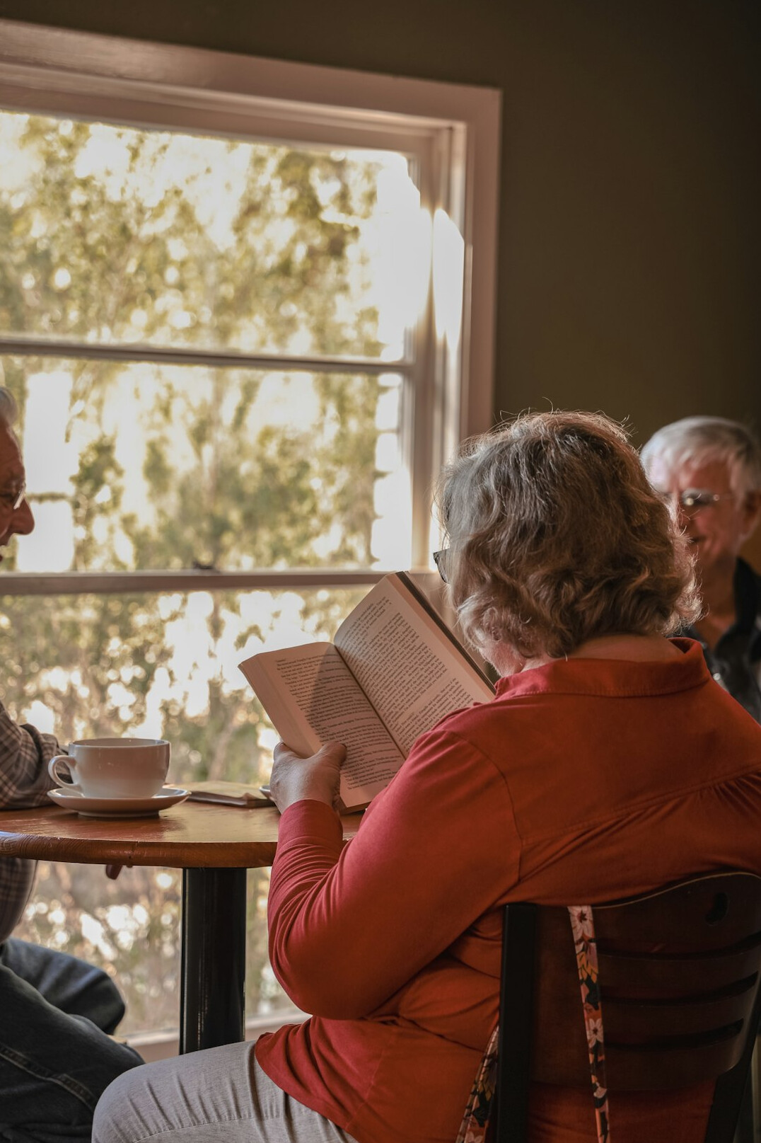 elderly women sharing tea and stories